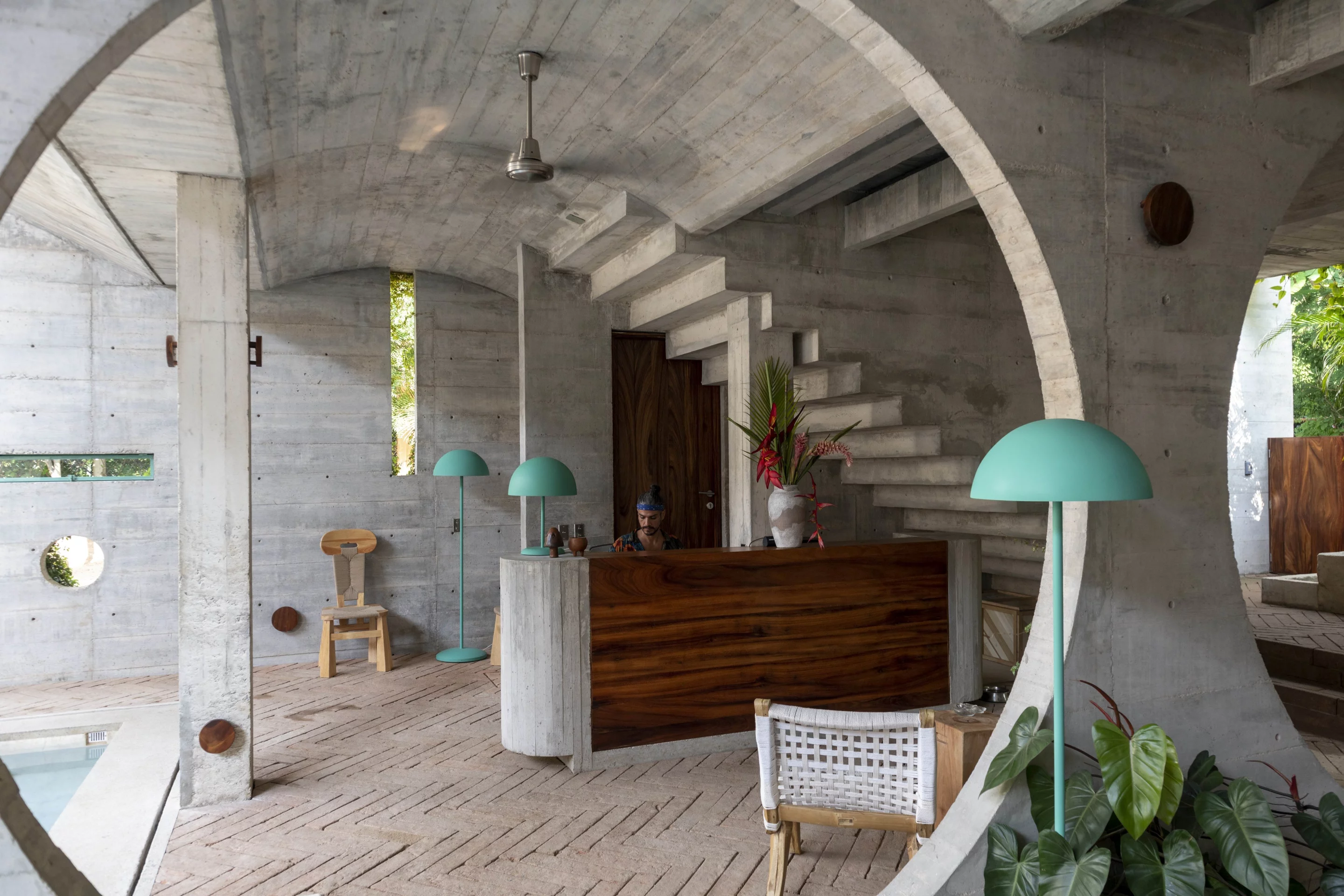 Casa TO's minimal timber reception desk embraces the outdoors