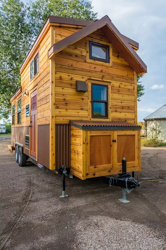 The battery array and other gear in Davis's 22 ft Off-Grid Tiny Home is stowed-away in the storage box shown