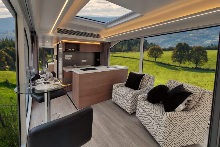 The view from the deck looking into the living room and kitchen