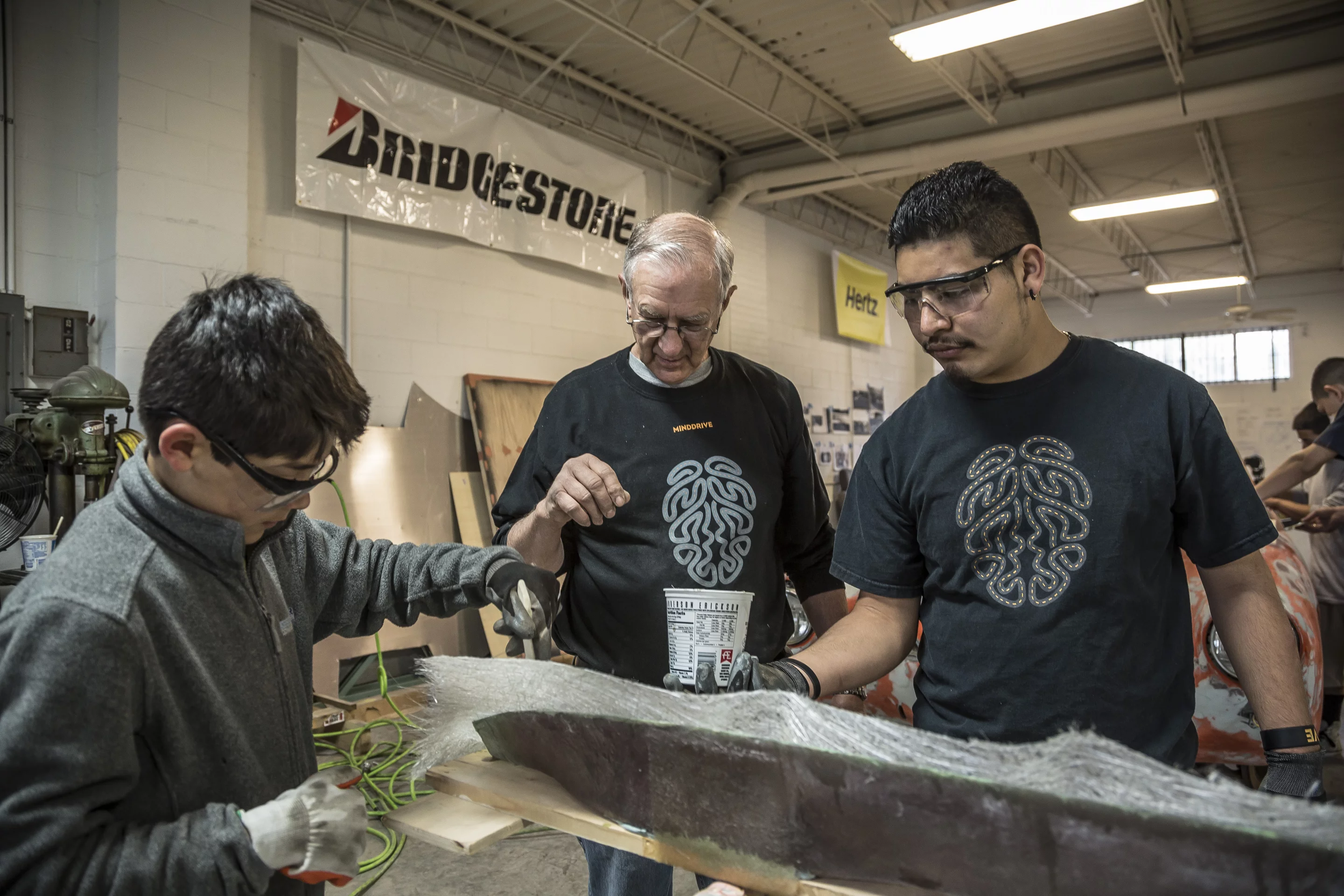 Mentor and students molding and shaping