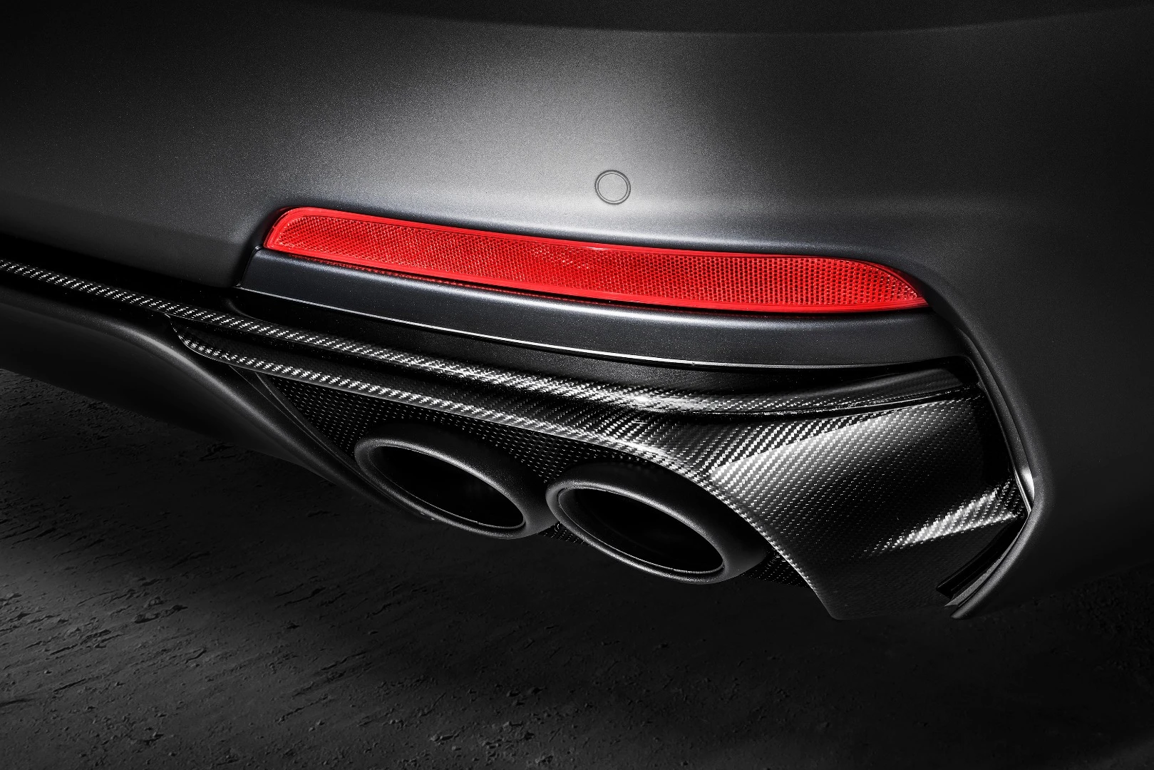 Exhaust tips below carbon fiber