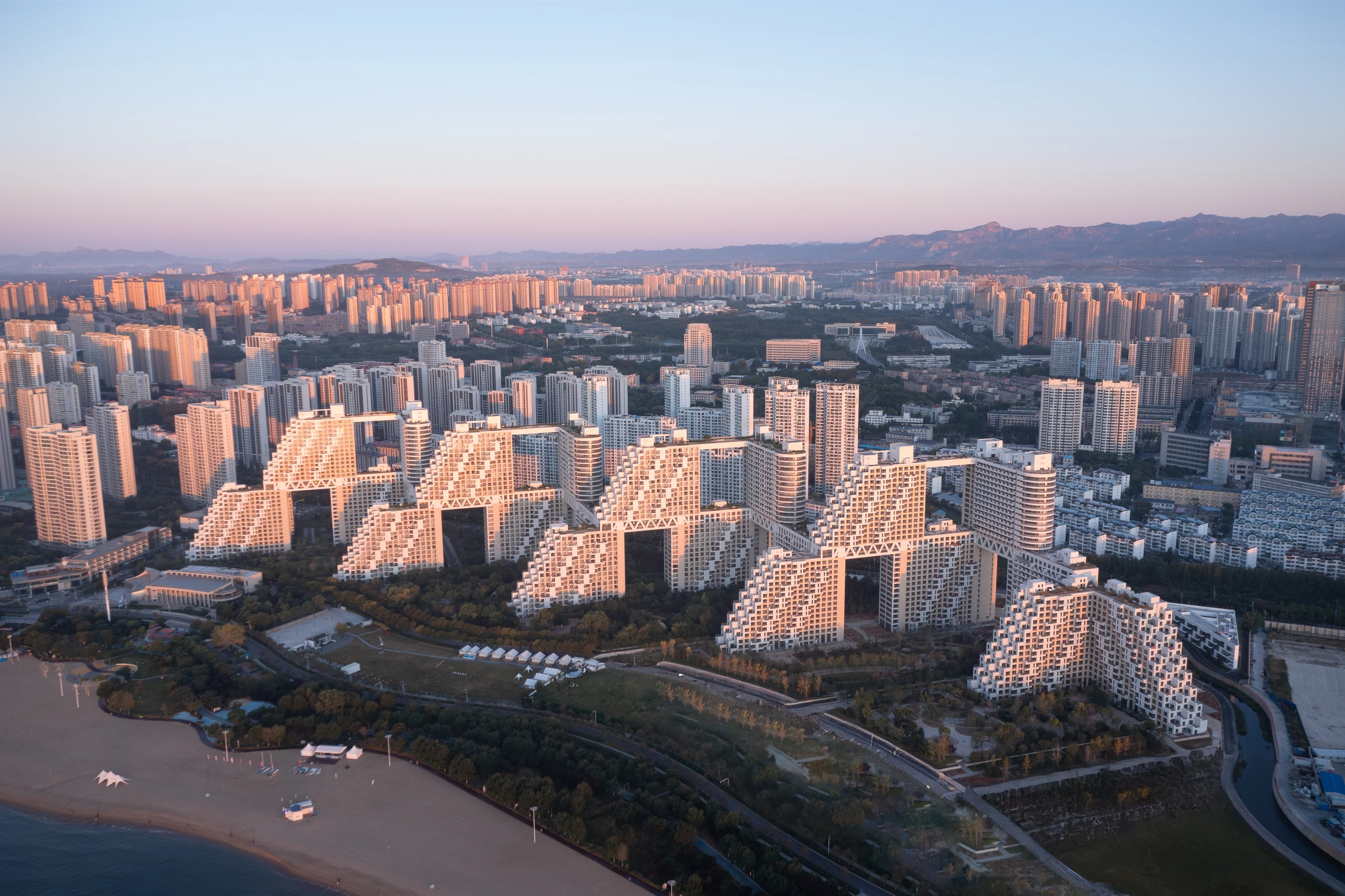 Habitat Qinhuangdao, by Safdie Architects, is located in China and is a high-profile residential complex by the renowned studio
