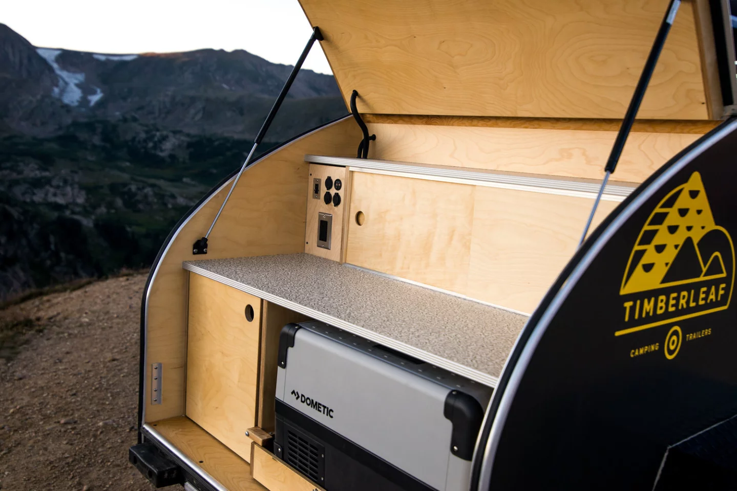 The rest of the kitchen includes dual countertops, electrical outlets and a storage/battery cabinet