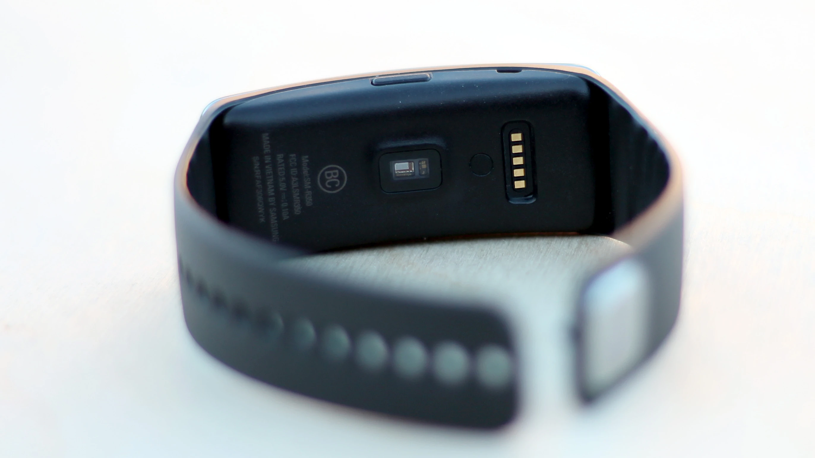 The heart rate sensor sits just below the charging coils, on the Gear Fit's backside