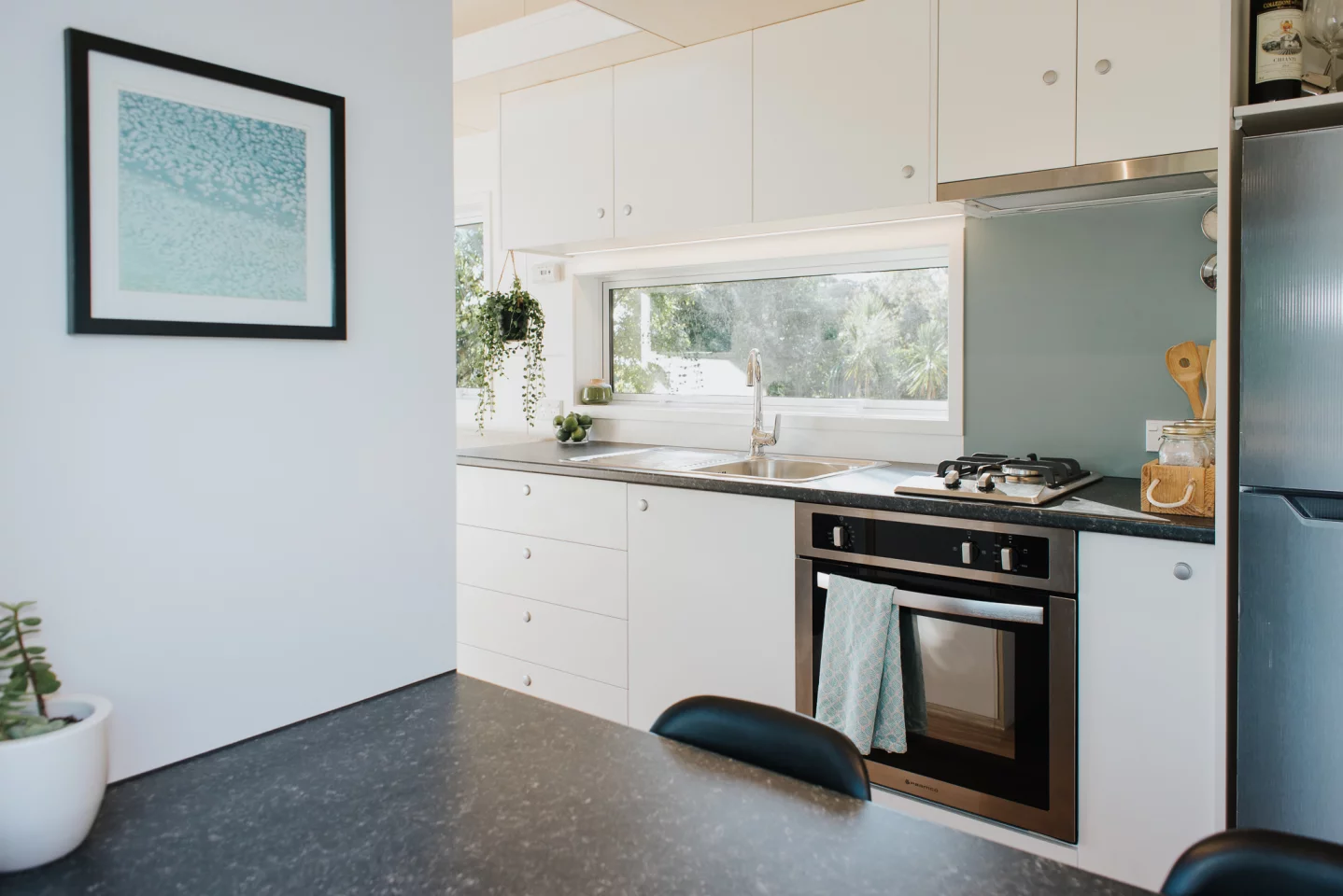 The Bitser Tiny House's kitchen has quite a bit of cabinet space available