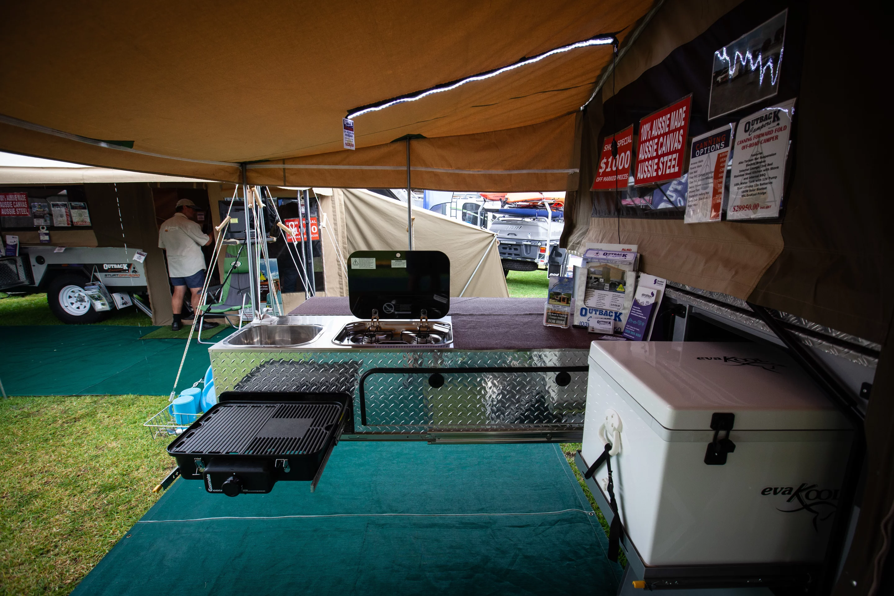 The Outback Canning has a particularly well-equipped kitchen with full slide-out including a three-burner stove and standard BBQ grill and separate slide with 85L EvaKool fridge