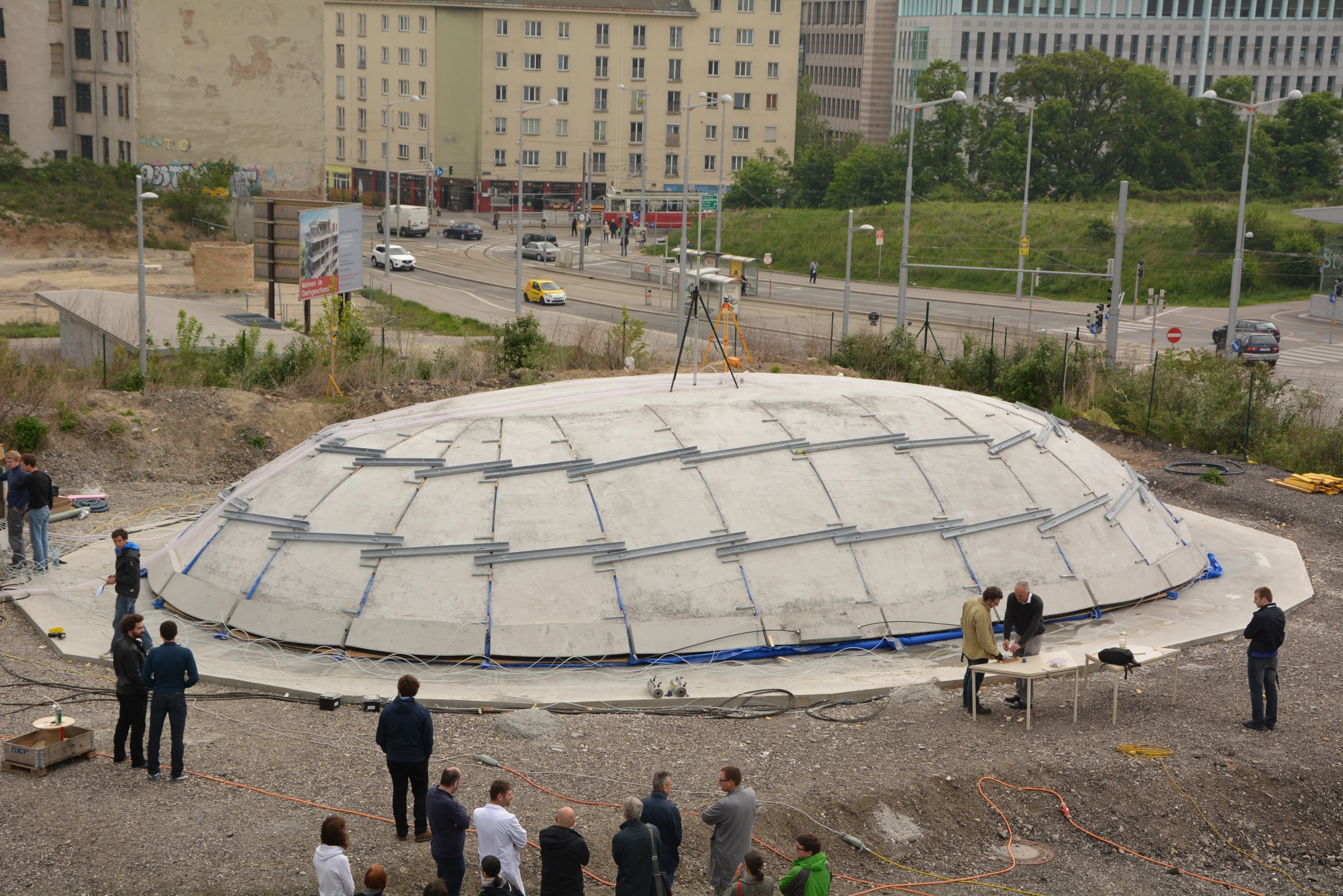 As the air cushion inflates, it lifts the slabs up from underneath, causing them to bend with it in the process