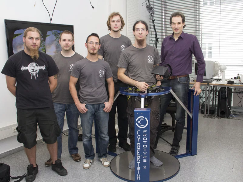 The Virtualizer team members with their device