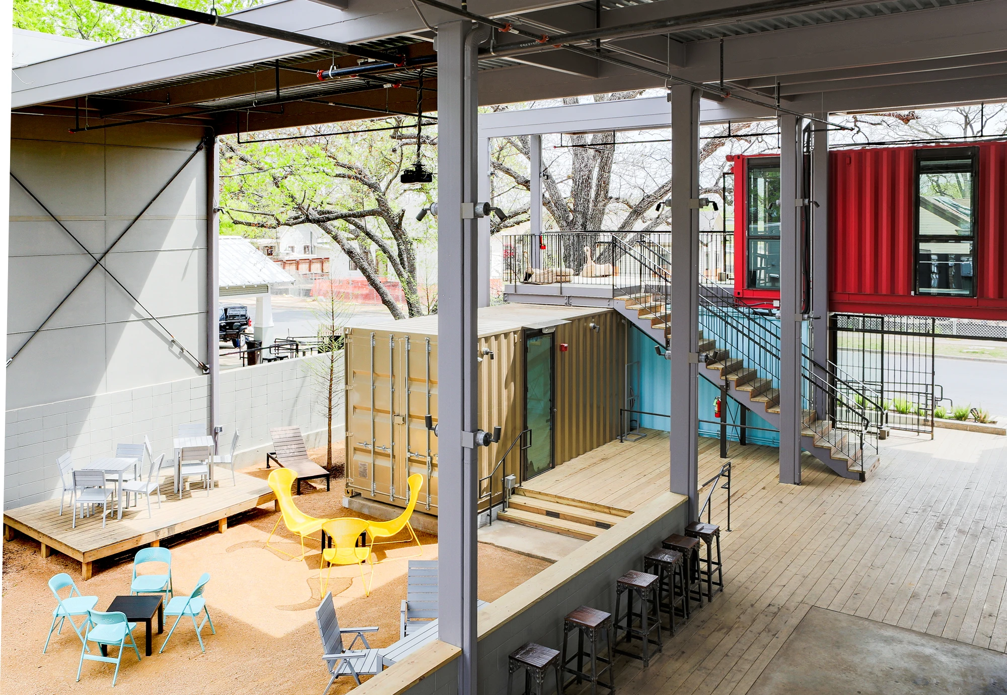 The containers are arranged to form a central open-air courtyard space with a small bar in the middle (Photo: Chris Perez)