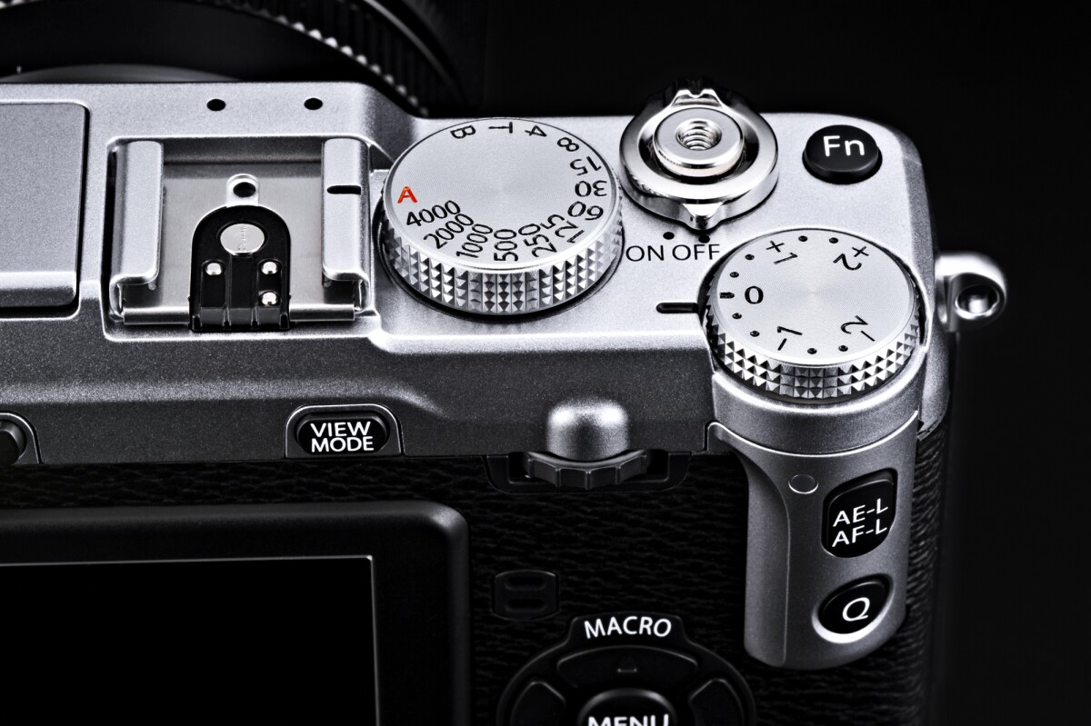 Manual control dials for shutter speed and exposure feature on the top panel of the Fujifilm X-E1 along with a Fn (Function) button