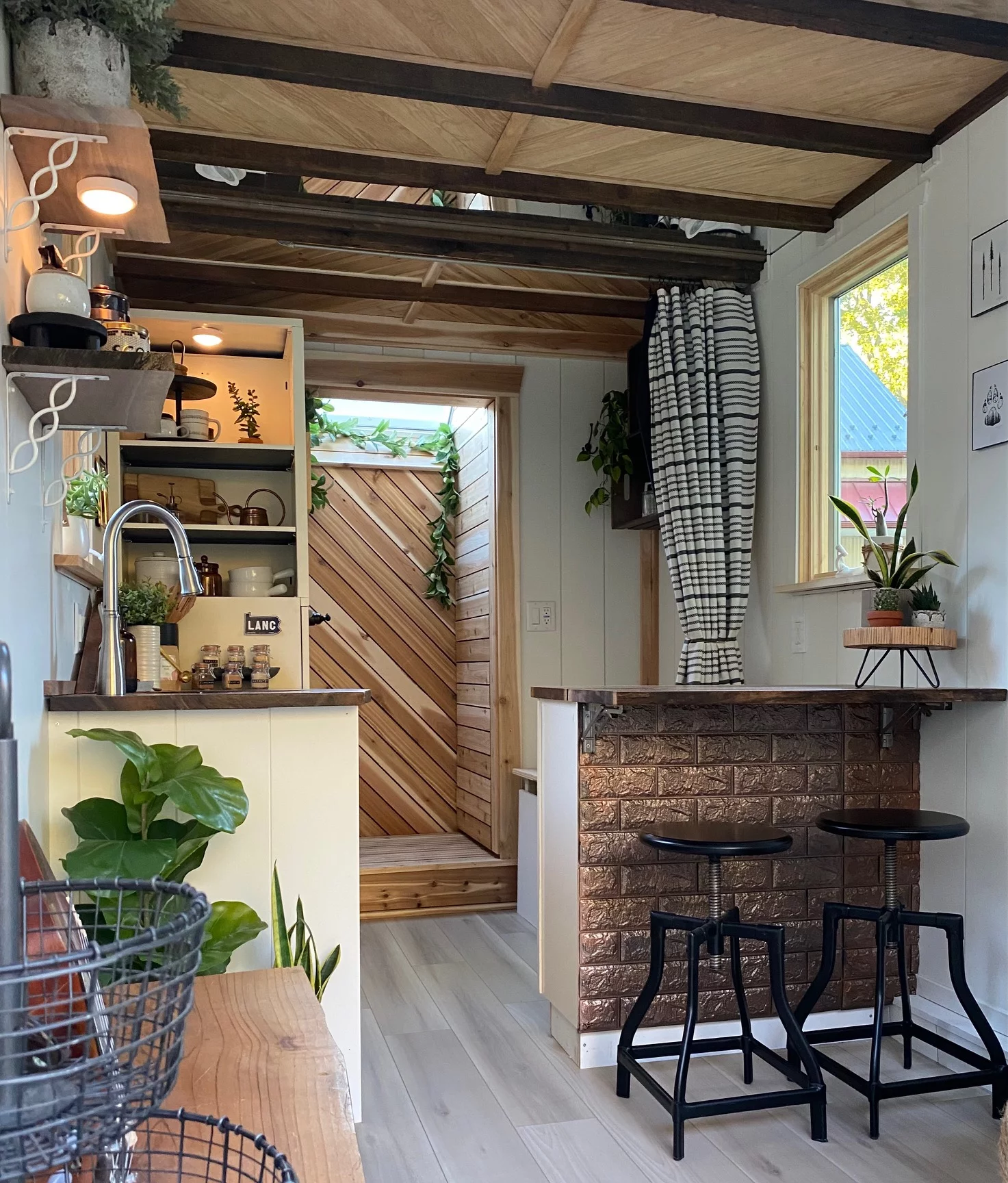 The Mountain interior is warm and inviting, featuring distressed barn wood beams on the ceiling