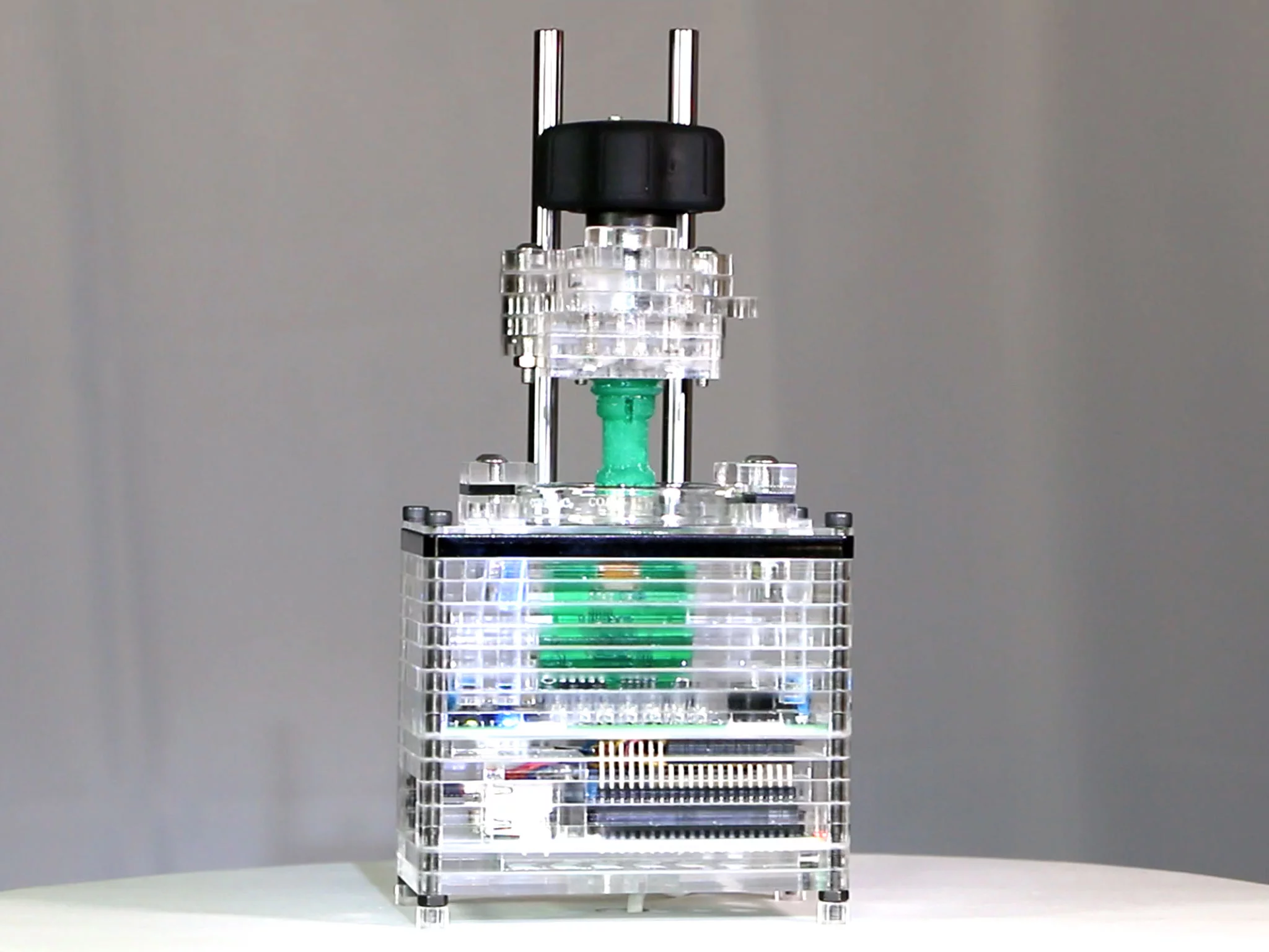 An iBox Nano prints a chess piece with its small but quiet resin printing system