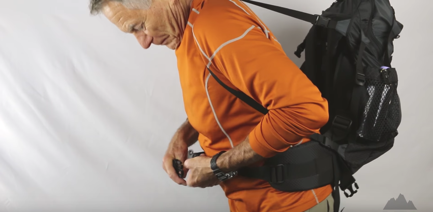 The support strap holds the pack in place while you secure the belts