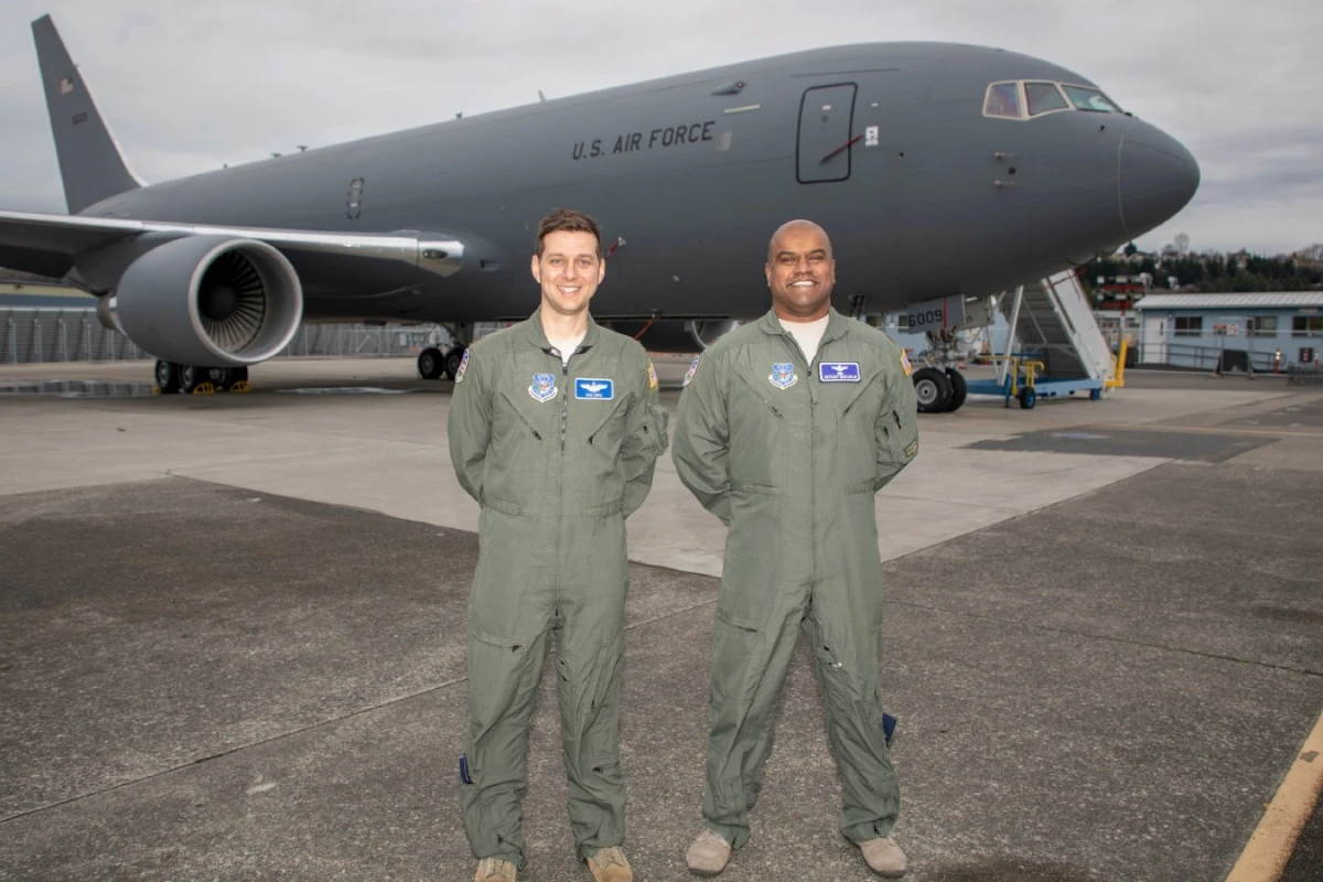 Nick Cenci, Major, USAF Chief of Flight Operations DCMA (Seattle) (left) and Anthony Mariapain, Major, USAF KC-46 Chief Pilot DCMA (Seattle) stand in front of the KC-46A Pegasus at Boeing Field in advance of the U.S. Air Force acceptance of Boeing’s first tanker