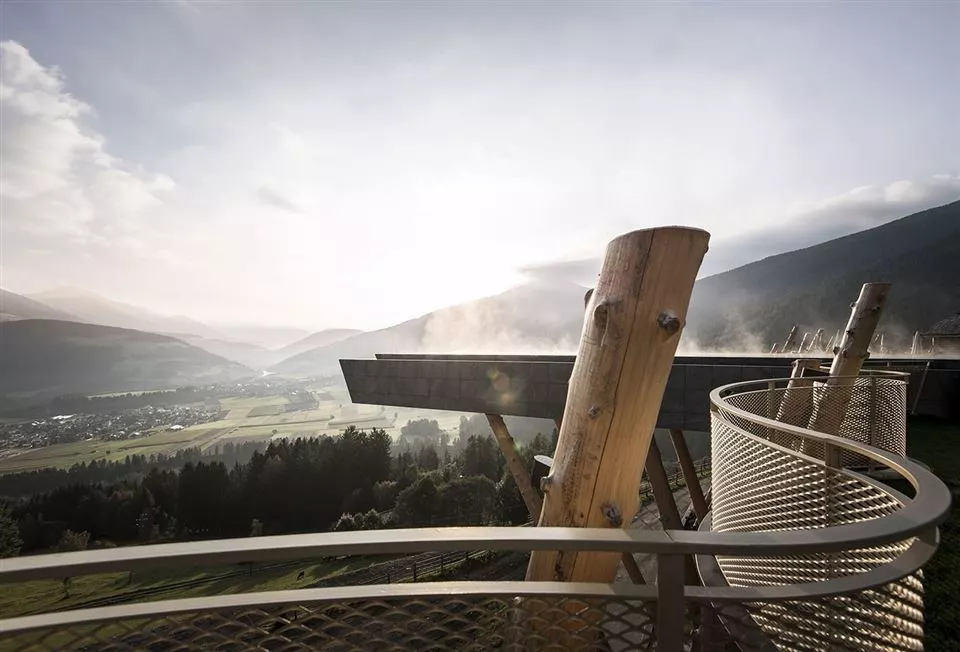 The Hubertus Hotel is an unusual-looking building, with a series of tree trunks, stripped of their bark, laid up against its facade