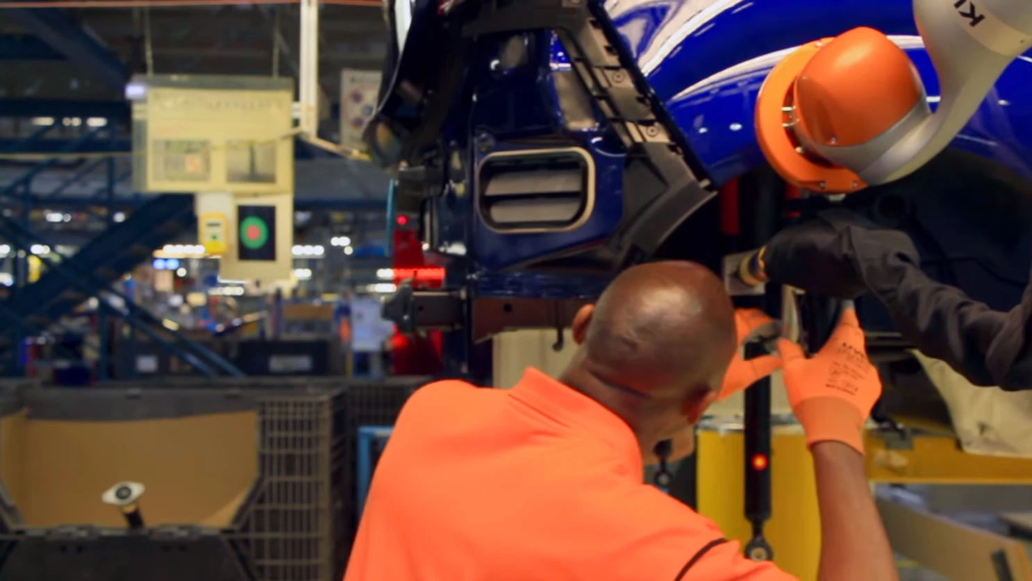 The robots sense human contact, and stop their movement to protect the workers