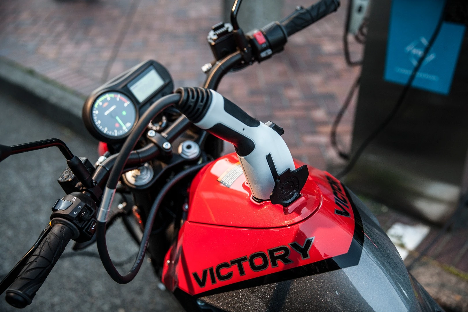 The bike has a built-in battery charger accessible through a SAE J1772 plug