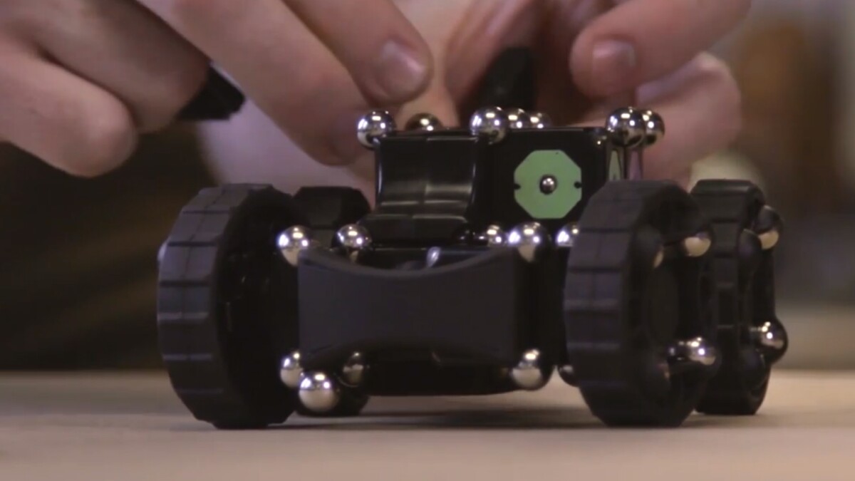 A carbon steel ball bearing/neodymium rare earth magnet connection system provides plenty of flexibility