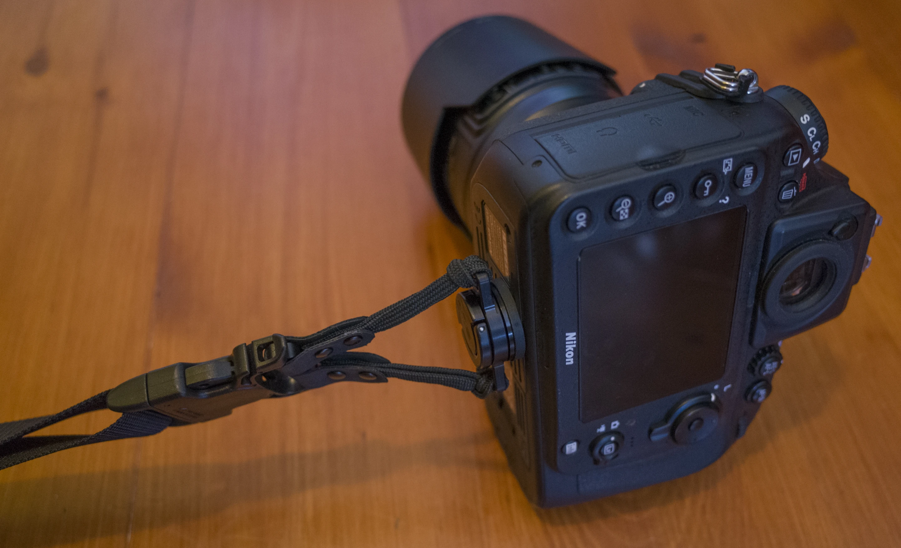The Custom SLR Dual Camera Strap attaches to cameras using a C Loop Mount which screws into the tripod socket