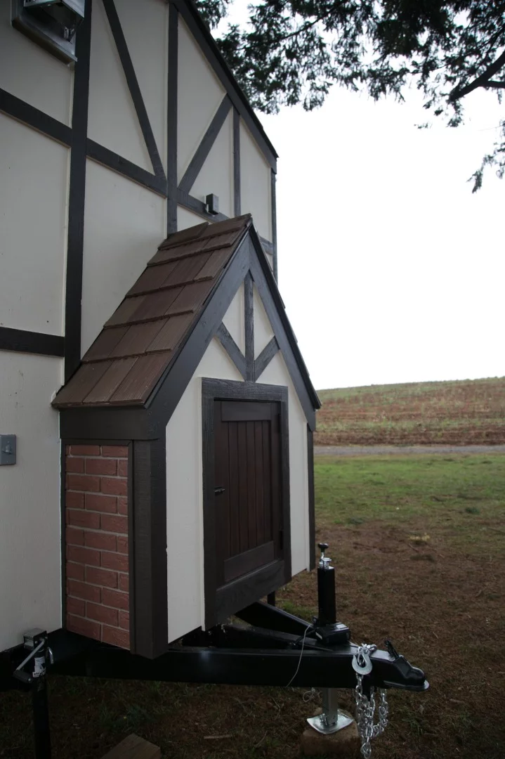 The Tudor-style tiny house is based on a triple-axle trailer
