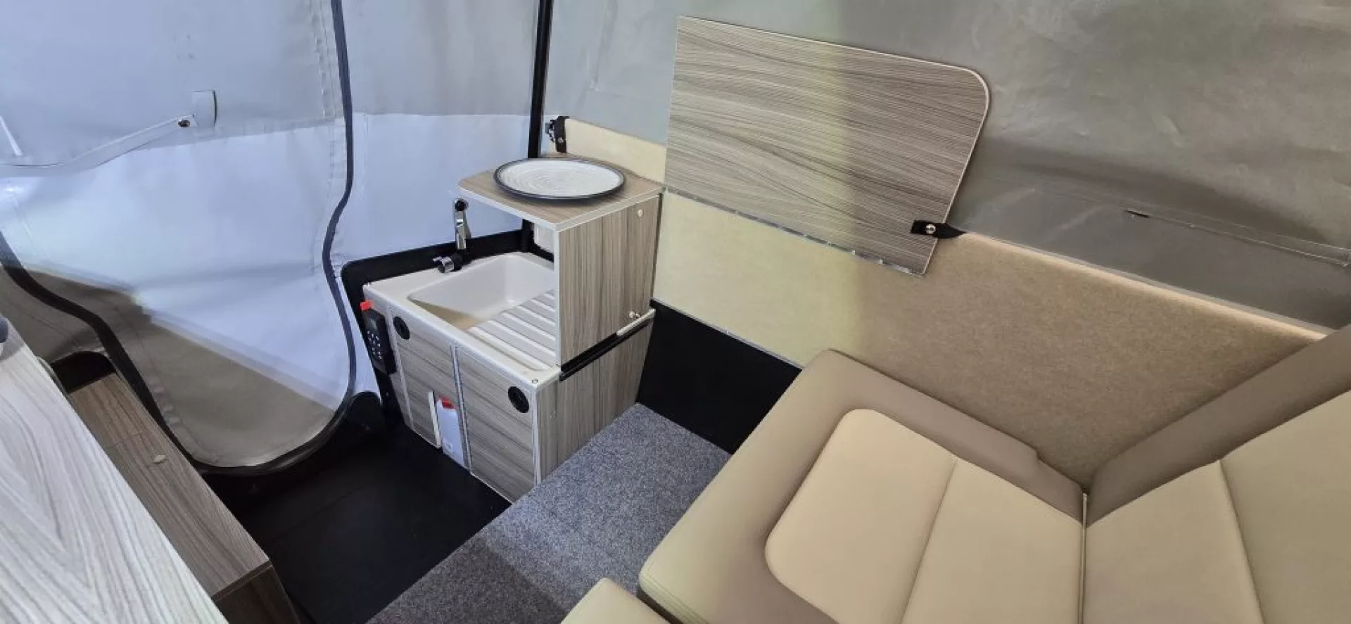 Thanks to less need to shave every ounce, the Dashaway eCT trailer will come more fully equipped with its own electrical hardware and water system (Source : Wheelhome)