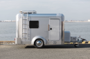 The X-Cabin shares its shape with basic commercial and horse trailers but gets upgraded into a stylish trailer trailer with its polished aluminum skin, windows, baby moon wheels and accessories