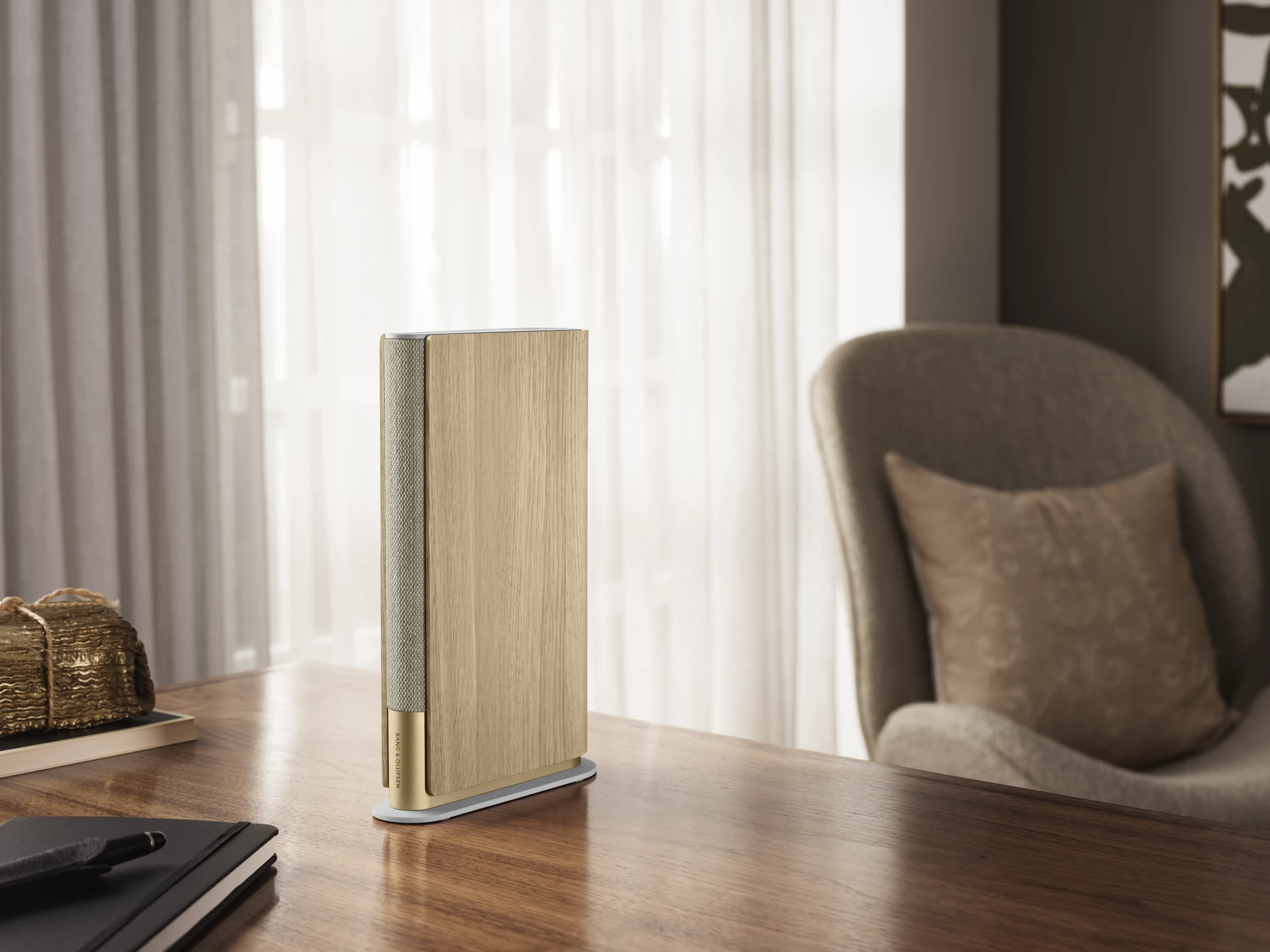 The Gold Tone model comes with oak side panels and a woven Kvadrat textile spine