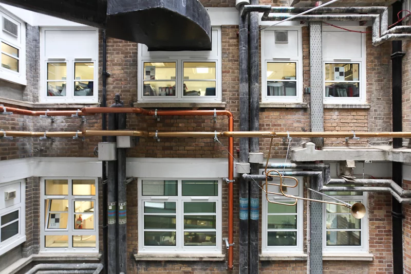 Rather than attempt to hide the untidy pipework, Studio Weave instead made a feature of it