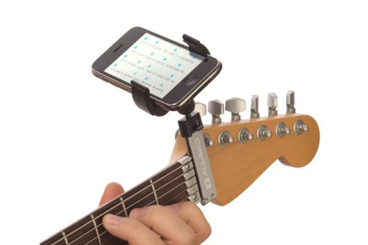 The Guitar Sidekick portable device mount places a smartphone or media players at the end of a guitar's fretboard for comfortable viewing of music notation, tabs, lyrics and so on