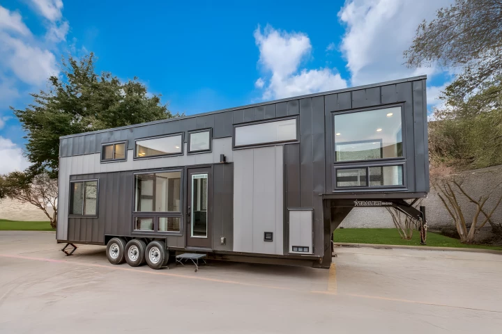 The Wilhite tiny house, by Indigo River Tiny Homes, is finished in metal and is based on a triple-axle gooseneck trailer