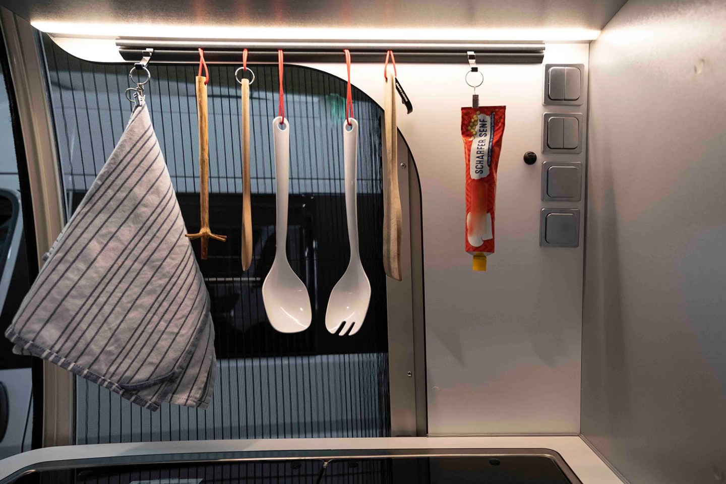 Rocket Camper's rails keep cooking tools (and hot mustard) close at hand