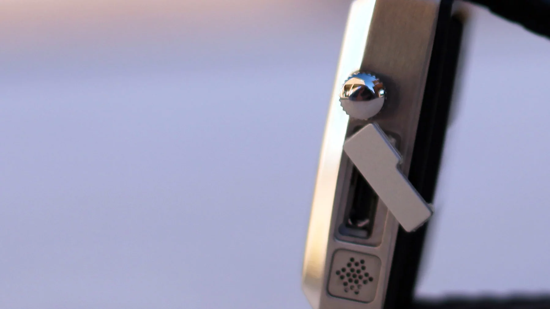 A tiny compartment reveals a microUSB charging port