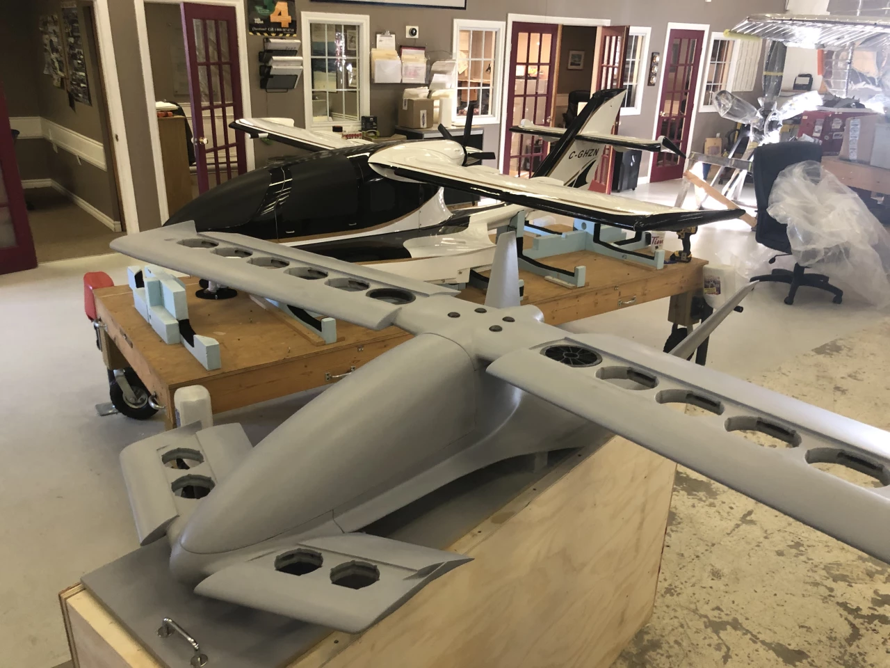 The 1:6 scale Cavorite X5 prototype, beside a previous 1:4 scale X3 amphibious aircraft prototype