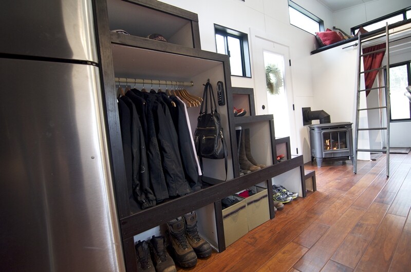 The staircase doubles as a space for storage