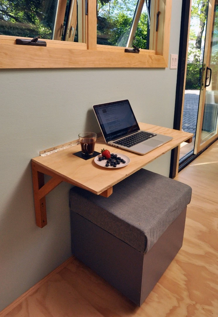 A small dining table doubles as a work space