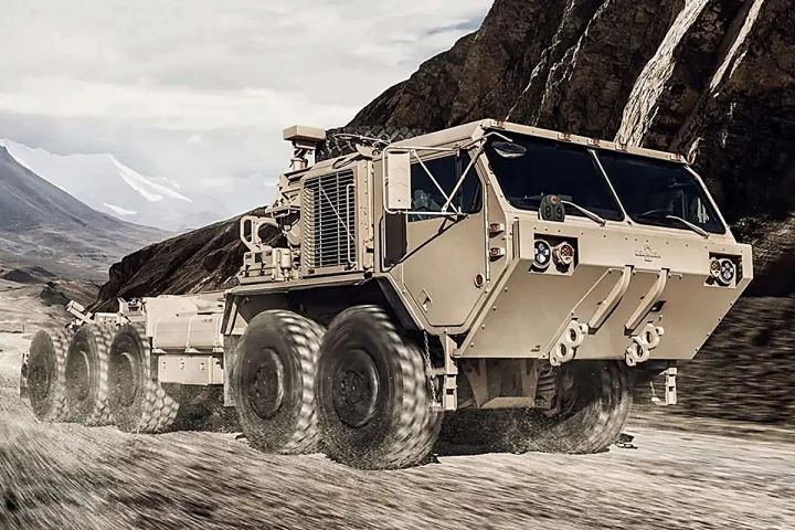 Oshkosh's PLS heavy tactical vehicles are designed to carry large payloads and keep up with tracked counterpartsacross virtually any terrain