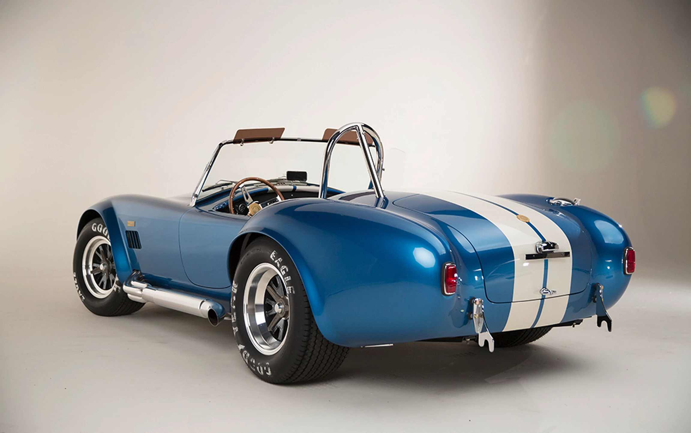 Each continuation Cobra will be painted Guardsman Blue with Wimbledon White stripes, equipped with a premium black leather interior and other special touches and the car will make it's public debut at the Barrett-Jackson Auction in Scottsdale, Arizona on January 12, 2015.