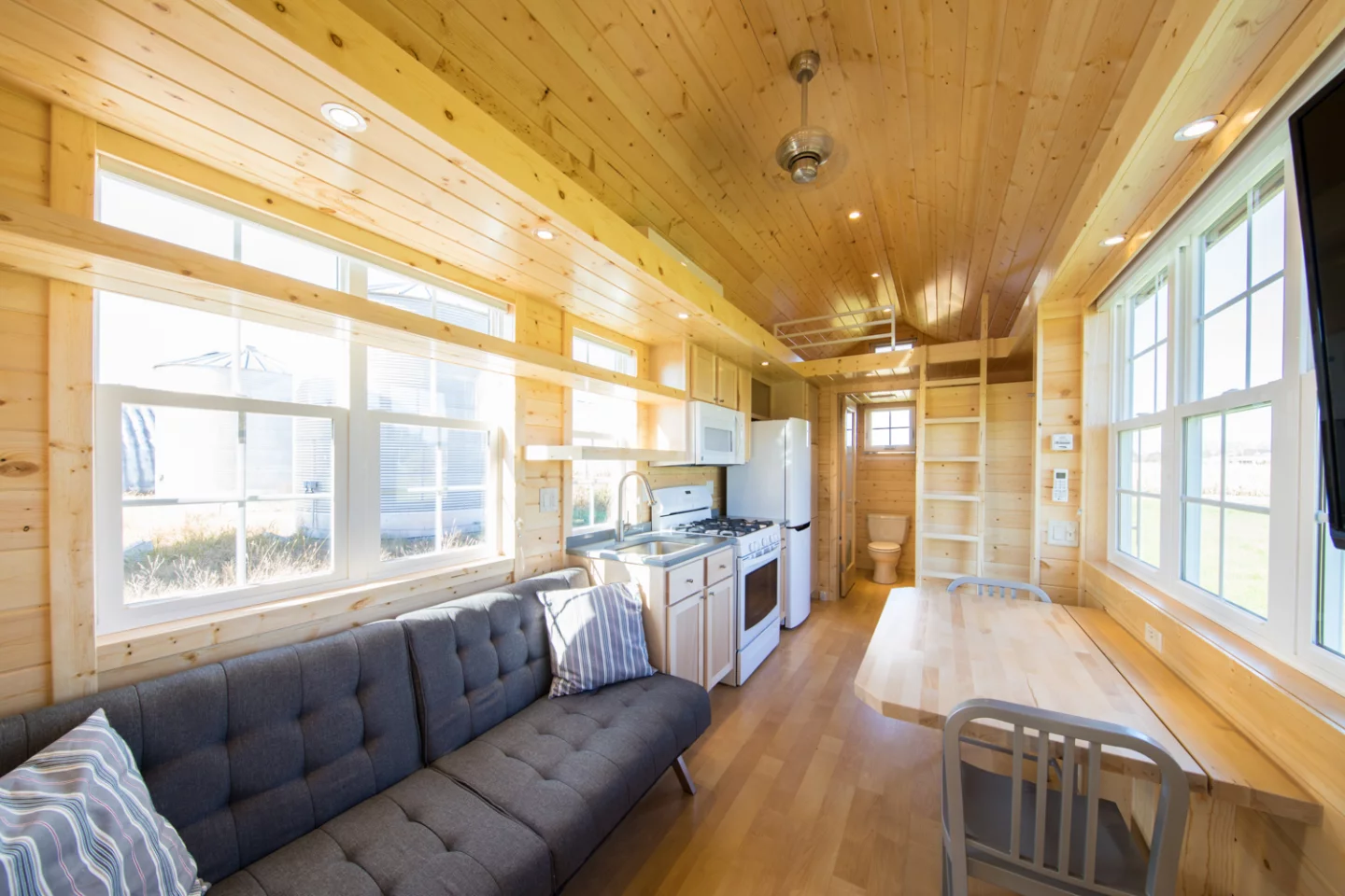 The interior of the Vintage XL consists of a large living/dining space that includes a couch with a pull-out bed