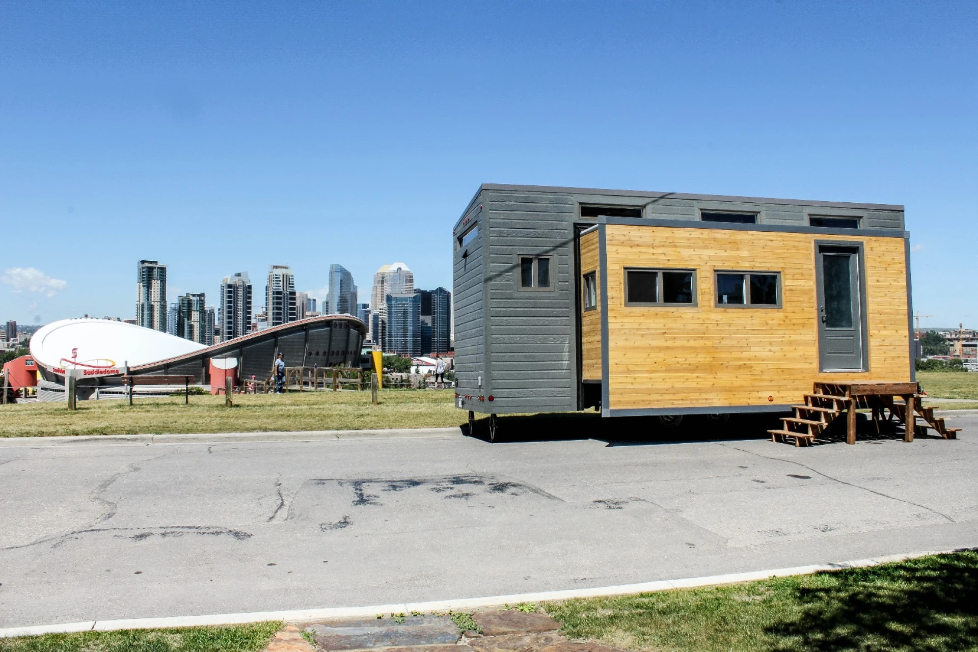 Compact tiny house expands in size to offer more living space
