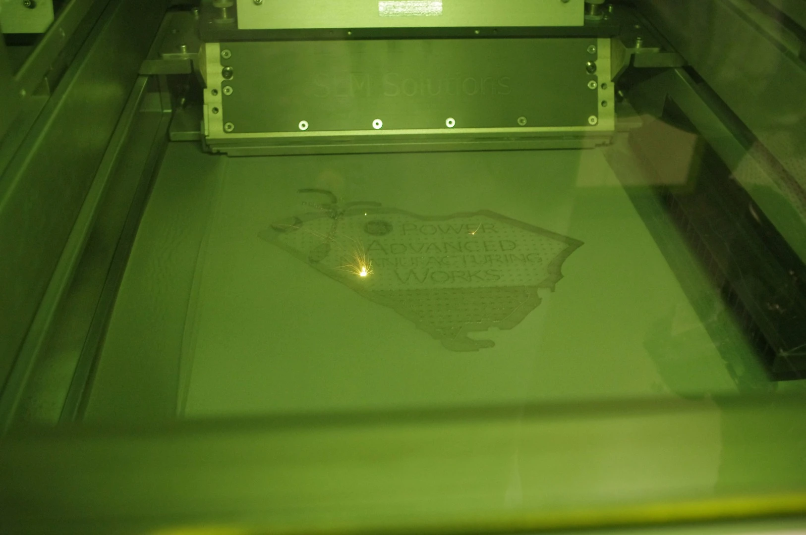 A look inside one of the 3D printers which uses lasers and metal powder to build up parts from scratch