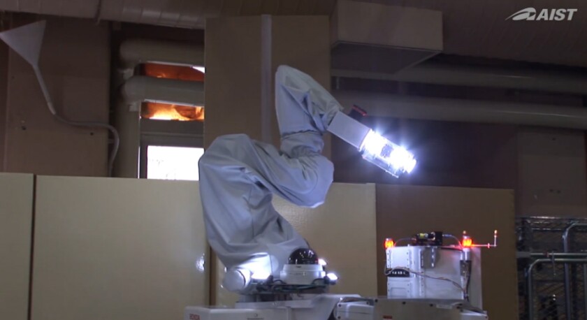 The 11-jointed arm curls up while the robot is moving to avoid bumping into things