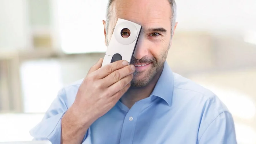 A handheld device is used to power and read the Eyemate implant