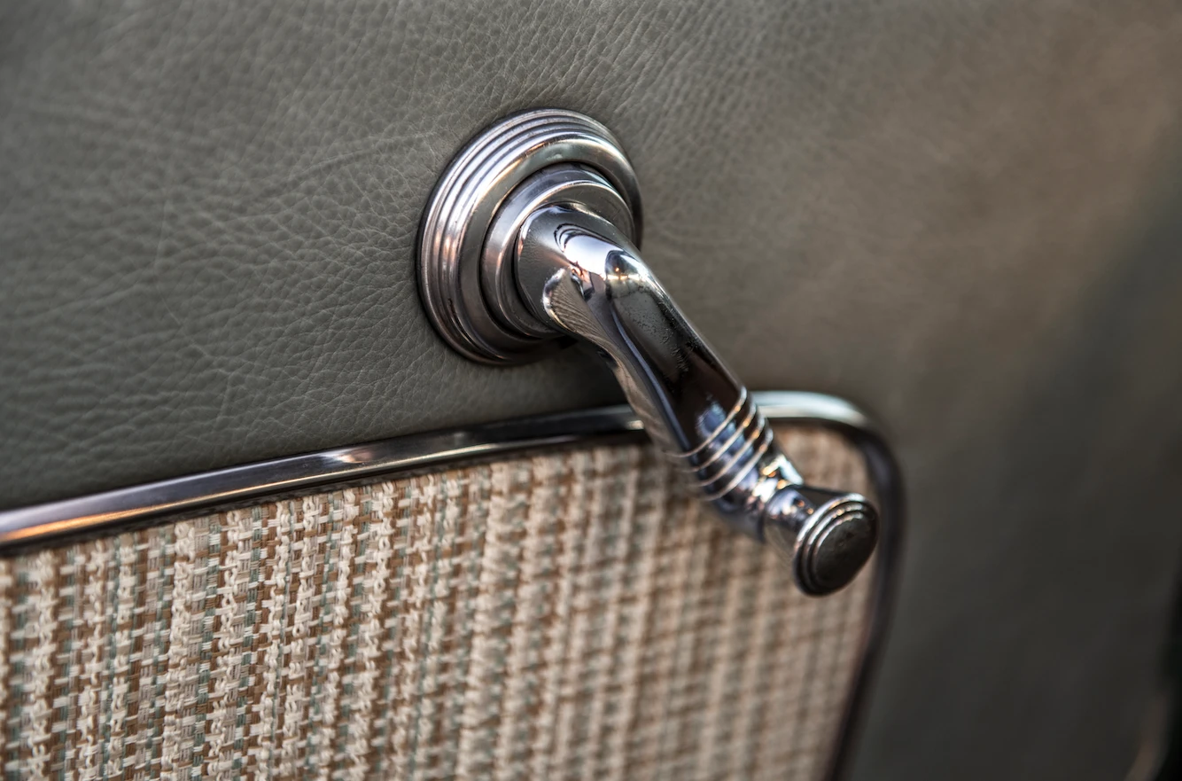 The original window cranks operate the power window system