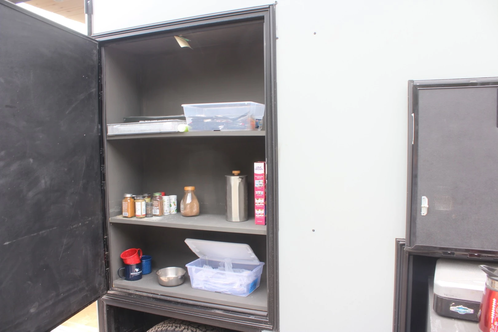 The outdoor pantry keeps dry food, spices and other provisions right next to the kitchen