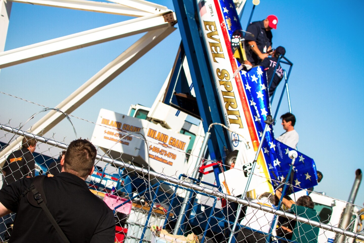 Eddie Braun climbs the ladder to get into the rocket bike