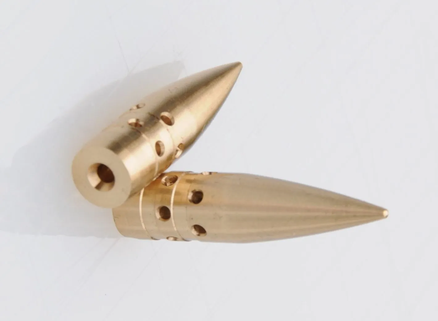 CompBullets are claimed to go faster than regular bullets, due to vents that have been machined into their sides
