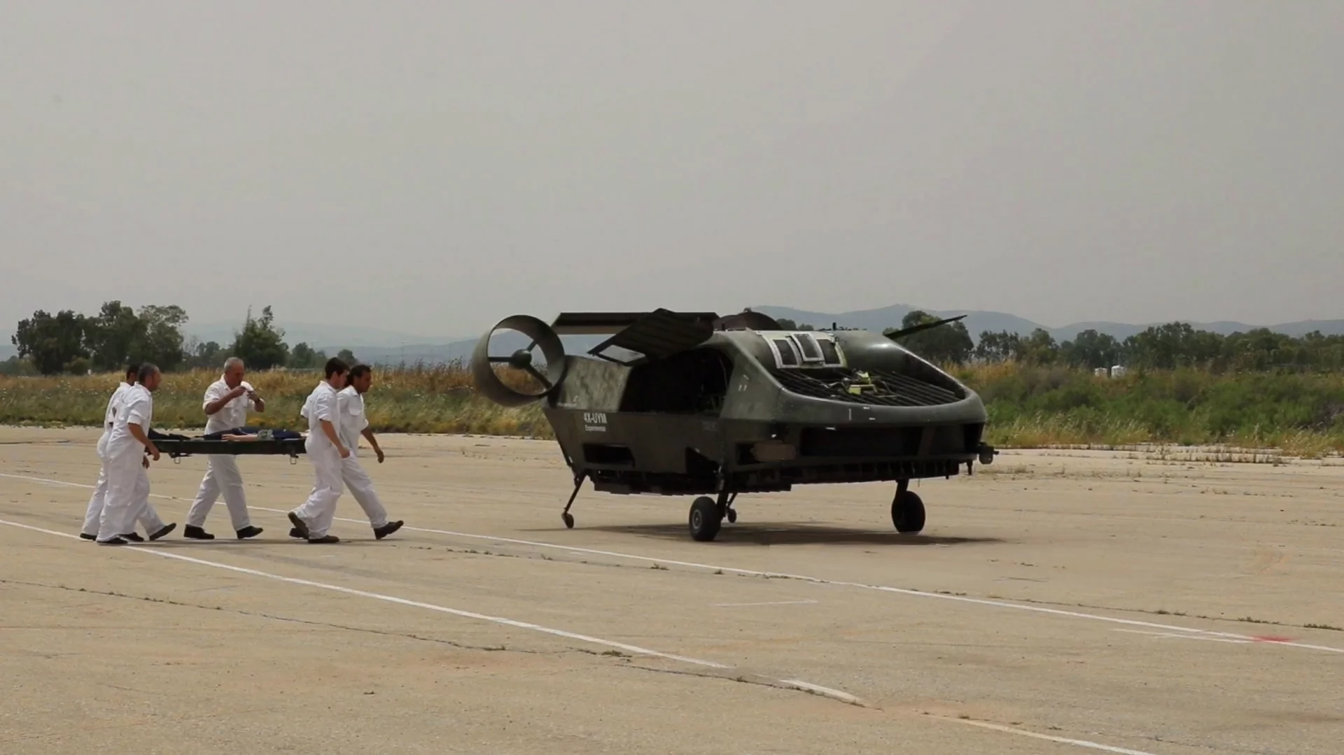 A ground crew loads a mannequin onto the Cormorant