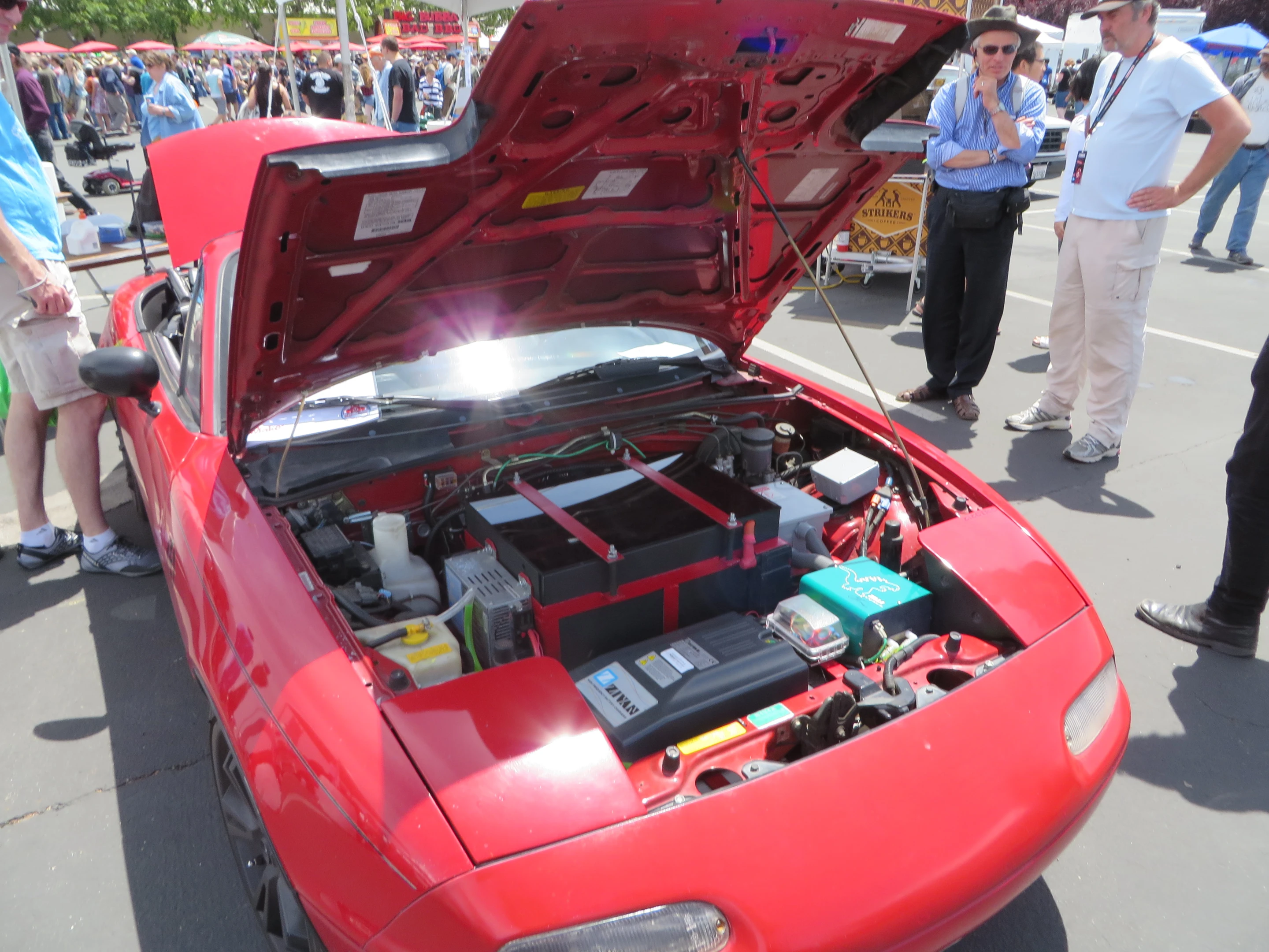 The Miata's internally combusting guts have been completely replaced with an electron-based system