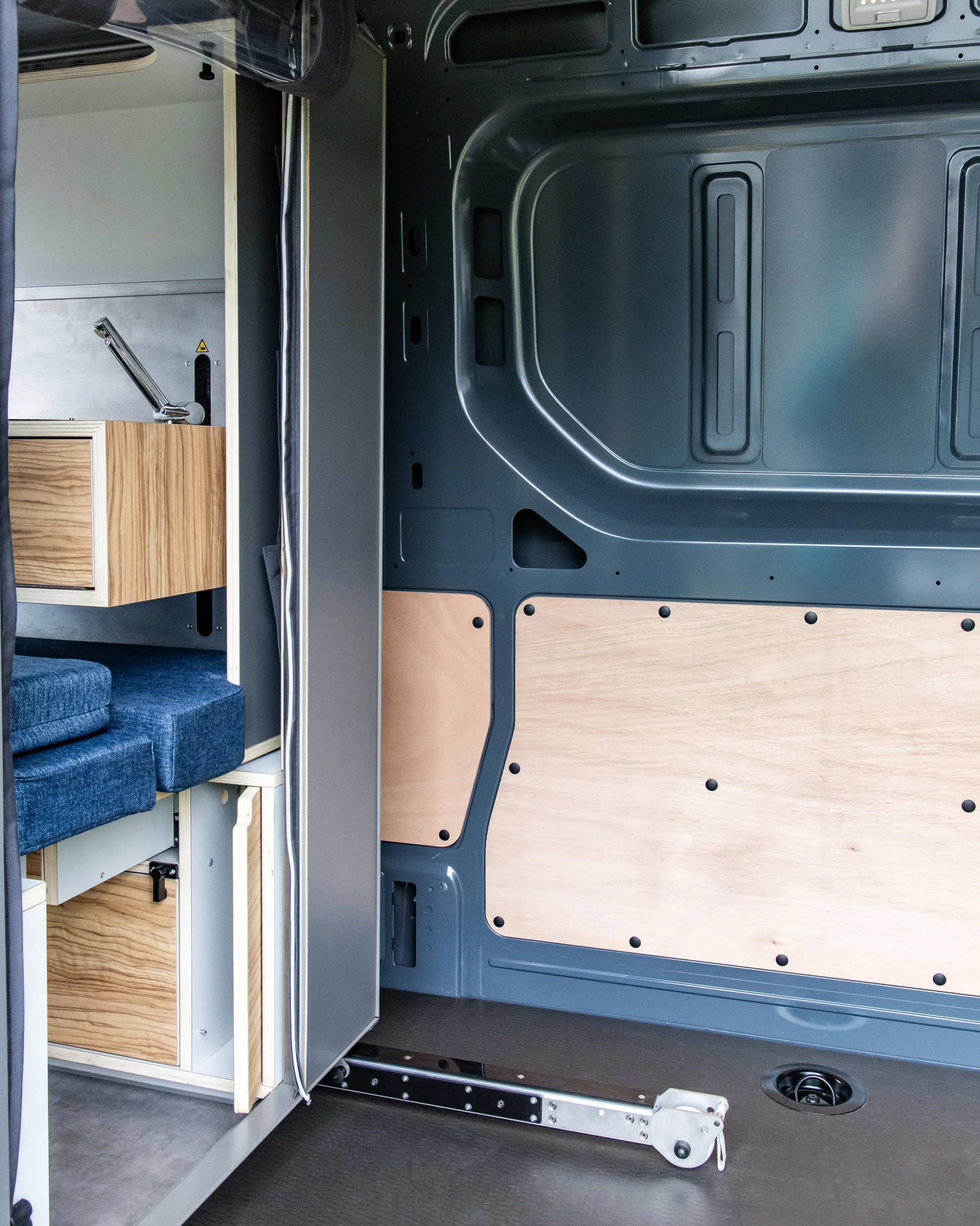 The space up front appears to leave enough room for PlugVan's bathroom - a must-have feature for many campers