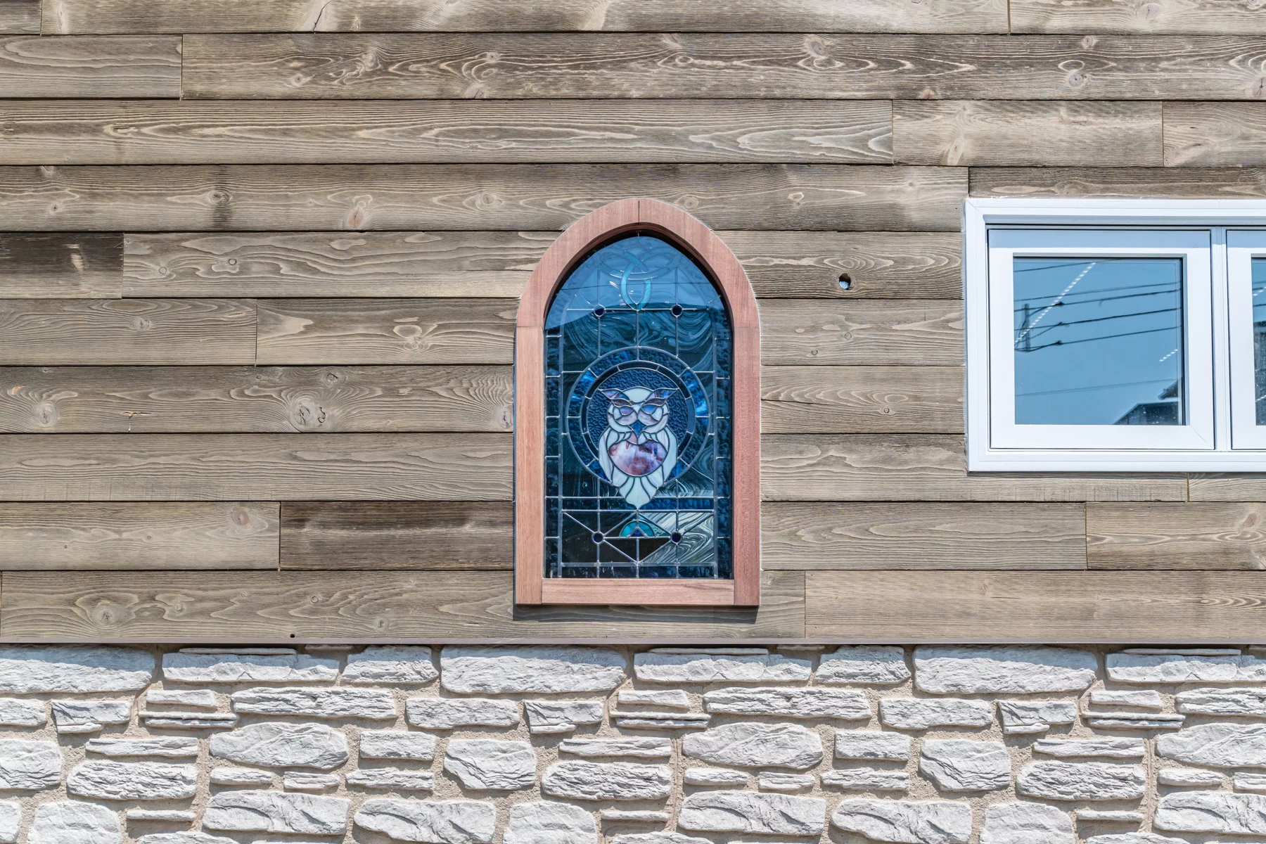 The Purple Heart Manor's glazing includes a stained glass feature window